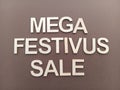 Mega Festivus sale sign on a brown background