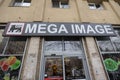 Mega Image logo in front of their local supermarket in Bucharest. Part of Ahold Delhaize, Mega Image is a Romanian chain of retail