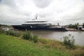 Mega ship yacht Lonian between small bridges and rivers at Gouda to Rotterdam