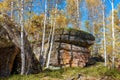 The megalith in autumn birch forests in Great Khingan