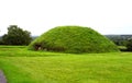 Smaller grass covered passage tomb