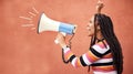 Megaphone, anger or black woman in protest with speech announcement for politics, equality or human rights. Young