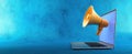 The Megaphone Emerging from a Laptop for Digital Communication.AI generated image Royalty Free Stock Photo