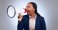 Megaphone, speech and screaming business woman in studio for change, transformation or freedom on grey background