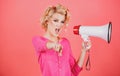 Megaphone and women. Portrait of pinup girl shouting. Young excited blonde woman screaming hot news, shouting in Royalty Free Stock Photo