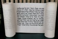 Megillat Esther (Book of Esther) scroll on black backround and talmud.