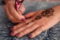 Mehendi Hands. Making temporary, henna tattoo Royalty Free Stock Photo