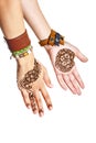 Mehendi or henna tatoo on the female hands in bracelets