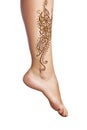 Mehendi or henna tatoo on the female leg in bracelets