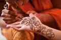 Mehndi Artist Paints Womans Palm