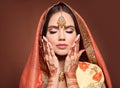 Mehndi. Portrait of beautiful indian girl in saree. Young hindu woman model with kundan golden jewelry set. Traditional Indian Royalty Free Stock Photo