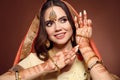 Mehndi. Portrait of beautiful indian girl in saree. Young hindu woman model with kundan golden jewelry set. Traditional Indian Royalty Free Stock Photo