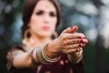 Mehndi tattoo. Woman Hands with black henna tattoos. India national traditions