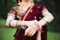 Mehndi tattoo. Woman Hands with black henna tattoos. India national traditions.