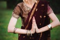 Mehndi tattoo. Woman Hands with black henna tattoos. India national traditions.