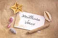 Meilleurs Voeux, written on a note in the sand with seashells Royalty Free Stock Photo