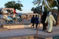 Meknes Boulevard where women and children walk and a beautiful carriage rides with a horse