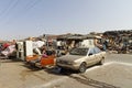 Meknes, Morocco, Feb,7,2019,Street fleemarket on sidewalk, blue sky with old covered sales hall. People try to sell