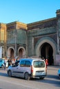 Road with cars in front of the main and most beautiful gate of Meknes Bab-El-Mansur