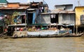 View on boat selling food on river with quonset huts background