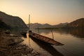 Mekong river fishing boat in Luang Prabang, Laos, South East Asia. Sunset light Royalty Free Stock Photo