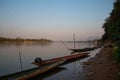 Mekong river fishing boat in Luang Prabang, Laos, South East Asia. Sunset light Royalty Free Stock Photo