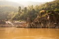 The Mekong river in Laos. River shore and tropical jungle.