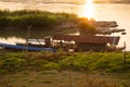 Mekong river, Laos and Thailand at Huay Xai. Traditional wooden boats at sunset