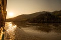 Mekong river, Laos. Travelling on a slow boat at sunset Royalty Free Stock Photo