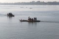 Mekong River Laos from the water showing riverbank activity and boats Royalty Free Stock Photo