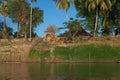 Mekong River Laos from the water showing riverbank activity and boats Royalty Free Stock Photo