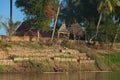 Mekong River Laos from the water showing riverbank activity and boats Royalty Free Stock Photo