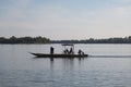 Mekong River Laos from the water showing riverbank activity and ferry boats Royalty Free Stock Photo