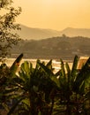 Mekong river, Laos and Thailand at Huay Xai. Sunset golden light on the river water.