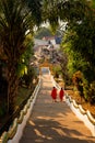 Mekong river village in Laos, Huay Xai. Temple steps with two young monks