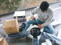 Electrical man install a ceiling fan Royalty Free Stock Photo