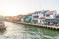 Melaka, Malaysia - February 12, 2019: Melaka old town at sunset. Malacca river in bakclight sunburst. UNESCO World Heritage Site, Royalty Free Stock Photo