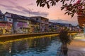 Melaka, Malaysia - February 17, 2019: Melaka old town by night. Malacca river illuminated at twilight. UNESCO World Heritage Site, Royalty Free Stock Photo