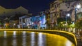 Melaka, Malaysia - February 17, 2019: Melaka old town by night. Malacca river illuminated at twilight. UNESCO World Heritage Site, Royalty Free Stock Photo