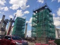 Installation of temporary scaffolding for the construction of tall concrete structures.