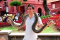 Melaka, Malaysia: Man with Snake Royalty Free Stock Photo