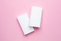 Melamine sponges on pink background, minimalism , white figure, kitchen and home cleaning