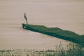 Melancholic, sad picture of an old abandoned and broken jetty Royalty Free Stock Photo