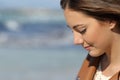 Melancholic woman thinking on the beach