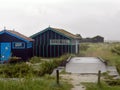 Wet wooden fisherman huts, sad and rainy weather. Ocean, Ile d\'Oleron, France Royalty Free Stock Photo
