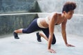 asian pacific islander athlete girl with afro performing exercising routines stretching