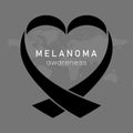 Melanoma awareness and black heart shape ribbon on map background. Skin cancer awareness