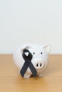 Melanoma and skin May cancer month, Black Ribbon with Piggy Bank for support illness life. Health, Donation, Charity, Campaign, Royalty Free Stock Photo