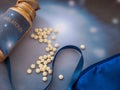 Melatonin supplements and sleep mask on the blue background Royalty Free Stock Photo