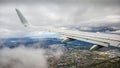 Airplane lowering altitude to below cloud level